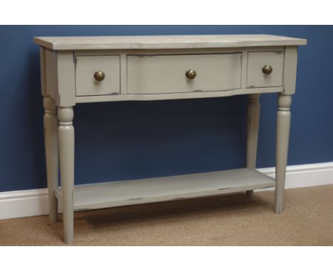 Grey finish break front console table with three drawers and undertier, W110cm, H80cm, D38cm   Condition Report   Click here 