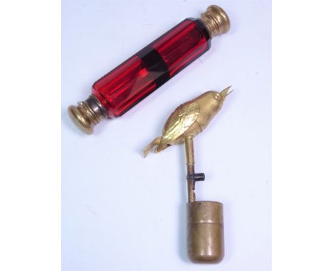 Victorian ruby glass double ended scent bottle and a Victory Canary Songster type bird whistle, c1920 (2)   Condition Report 