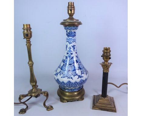 Oriental blue and white table lamp with brass footed base and fitting, H36cm, small brass corinthium column table lamp and a 