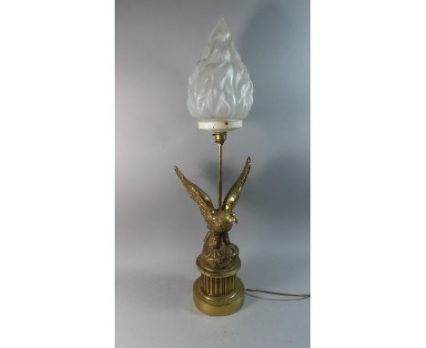 A Brass Table Lamp in the Form of Eagle with Outstretched Wings Having Opaque Glass Flame Shade, 78cm high 