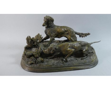 A 19th Century French Patinated Bronze Animal Group depicting Pointer and Setter marking a Partridge. Cast After Pierre Jules