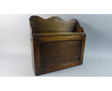 An Edwardian Oak Wall Hanging Sectioned Shelf Unit with Pull Down Front, 38cm Wide 