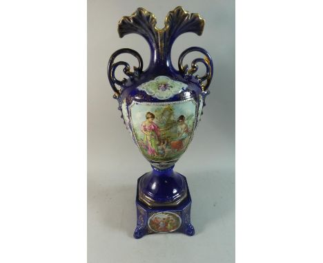 A Continental Cobalt Blue Two Handled Vase with Cartouche Depicting Cherubs and Maidens on Square Plinth, 53cm high 