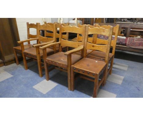 A Collection of Eight Pine Framed Hide Seated Ladder Back Chairs 