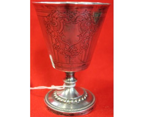 A continental white metal goblet, engraved with blind cartouche, on turned stem and circular platform foot, 12.5cm high, 130g