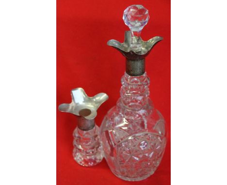 A cut glass decanter, with silver four spout pourer, Sheffield 1925, having a facet cut stopper, together with the top sectio
