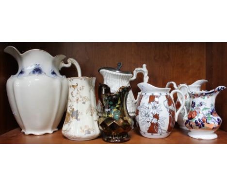 A shelf containing a selection of decorative ceramic jugs