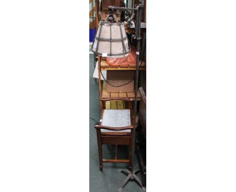 A wrought metal standard lamp, with cage shade &amp; adjustable bracket design