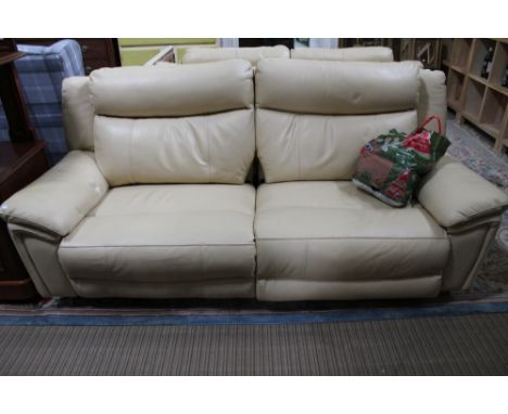 A cream leather two seater electric recliner sofa