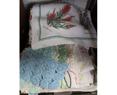 A box containing a collection of linenware to include tablecloths, cushion covers, doilies and napkins