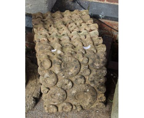 A set of eight reconstituted stone pavers, mould with ammonite design