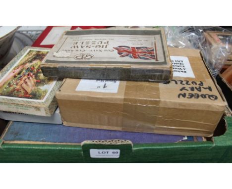 A box containing a varied selection of vintage games &amp; puzzles