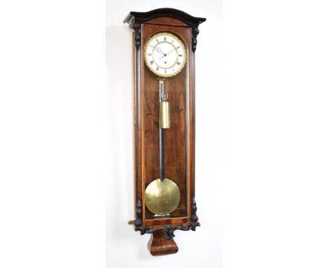 A 19th century Vienna regulator with rosewood case, carved ebonized mounts and satinwood beading. The white enamel dial has h
