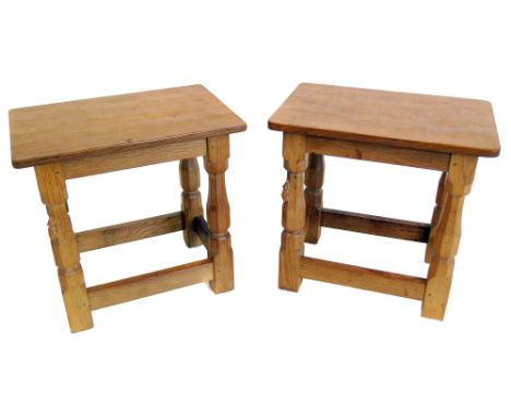 Robert "Mouseman" Thompson two matching occasional tables or stools, each with adzed rectangular top on turned legs united by