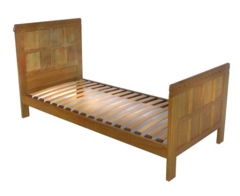 Robert "Mouseman" Thompson single bed, with eight panel foot and head board, united by side rails and mulitple laths, headboa