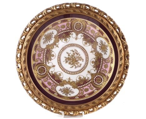 English porcelain plaque finely decorated with raised paste gilding and enamel work, 27cm diameter