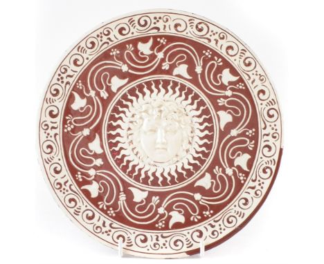 Renaissance revival plate possibly Cantagalli or Della Robbia, decoratedÂ with sgraffito and slip decoration surrounding a ce