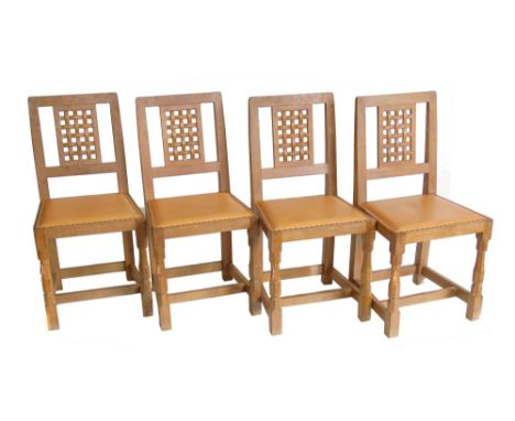 Robert "Mouseman" Thompson four single dining chairs, lattice splat back, leather close nailed seat, turned foreleg supports.