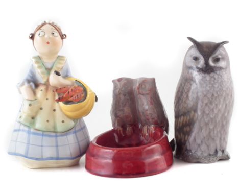 Royal Copenhagan owl, model number 2999, also a Danish pottery ashtray modelled with owls and a Czech figure of a lady with a
