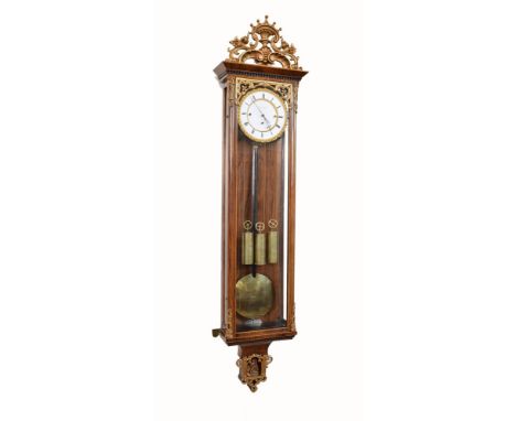 A 19th century triple weight Vienna regulator by Ludwig Hainz, Prague. The walnut case with satinwood stringing to the case a