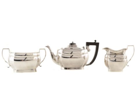 A 3-piece silver tea set , rounded rectangular forms with scalloped corners, hinged lid, faceted spout, black umbrella finial