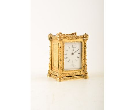 A mid 19th century brass framed carriage clock by Adams, Lombard Street, London. The case has intricately cast brass metalwor