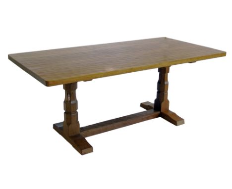 Robert "Mouseman" Thompson dining table, the rectangular top with adzed finish, standing on two substantial columns with tres