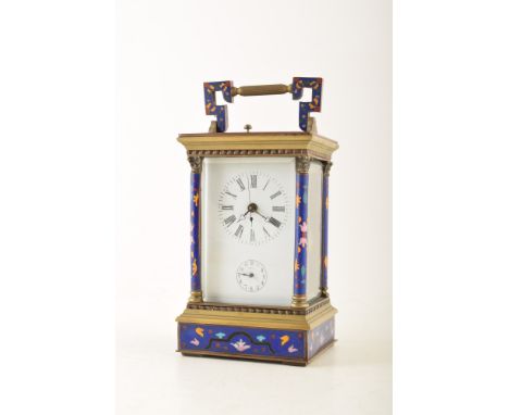A 19th century brass and cloisonnÃ© carriage clock. The brass frame and Corinthian columns are set with geometric cloisonnÃ© 