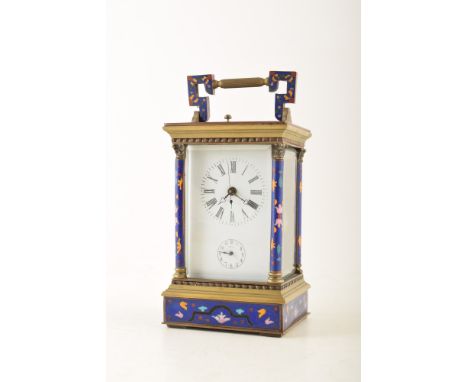 A 19th century brass and cloisonnÃ© carriage clock. The brass frame and Corinthian columns are set with geometric cloisonnÃ© 