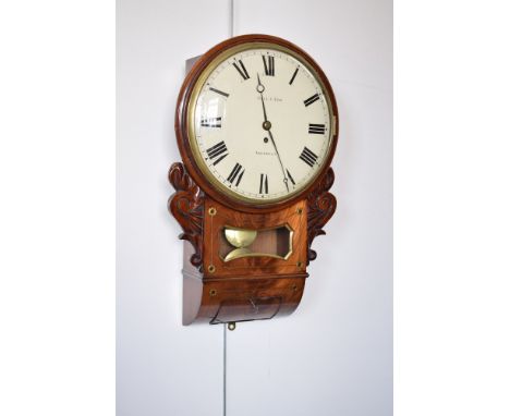 An early 19th century mahogany drop-dial wall clock by Gill & Son, Aberdeen, carved scroll brackets to the side, brass inlay 