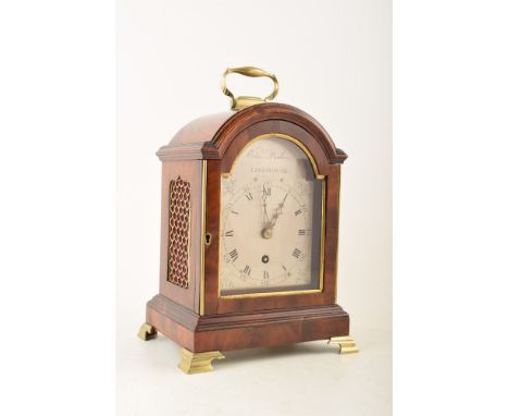 An 18th century mahogany bracket clock by Edmund Poole*, Limehouse, London. The case with arched pediment with brass carry-ha