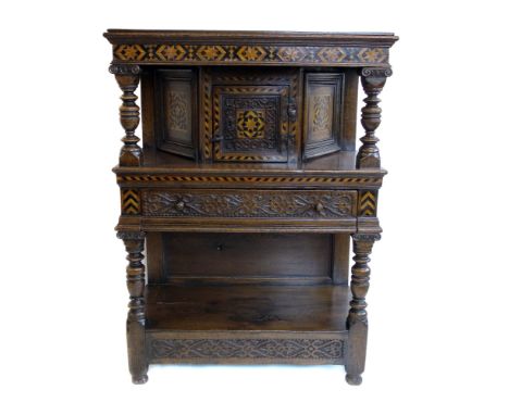 20th century Jacobean design side cabinet, rectangular top supported on turned columns with central cupboard, wrought metal h