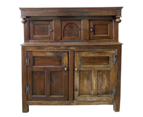 17th century North Wales oak jointed press cupboard, canopy with pendants punched with initials R.G.I.G., central heart and s