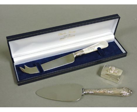 A modern boxed cheese knife, with a silver collar and mother of pearl handle, a modern cake slice with a silver handle, and a