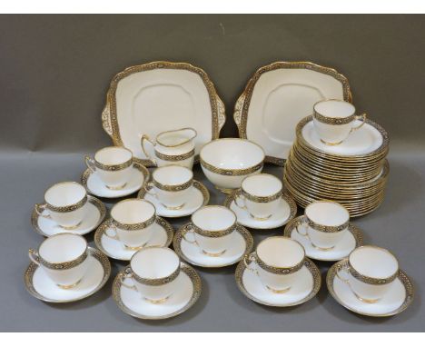 A Royal Albert tea service, white ground with gilt pattern