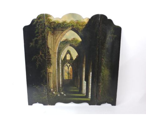 A Victorian papier mâché firescreen, painted with a ruin and inlaid with mother of pearl