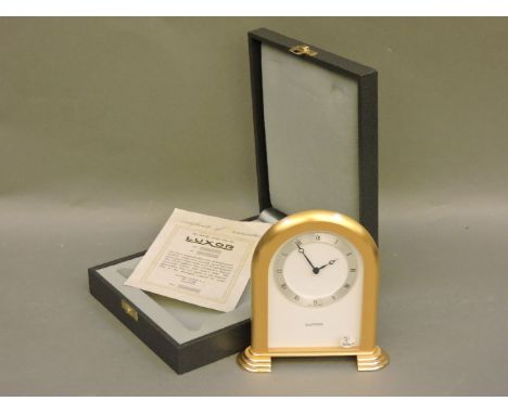 A gold plated Luxor quartz mantel clock, with fitted case and paperwork