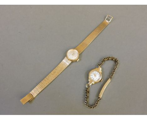 A ladies 9ct gold Record bracelet watch, and a ladies 9ct gold Rotary watch on a rolled gold bracelet