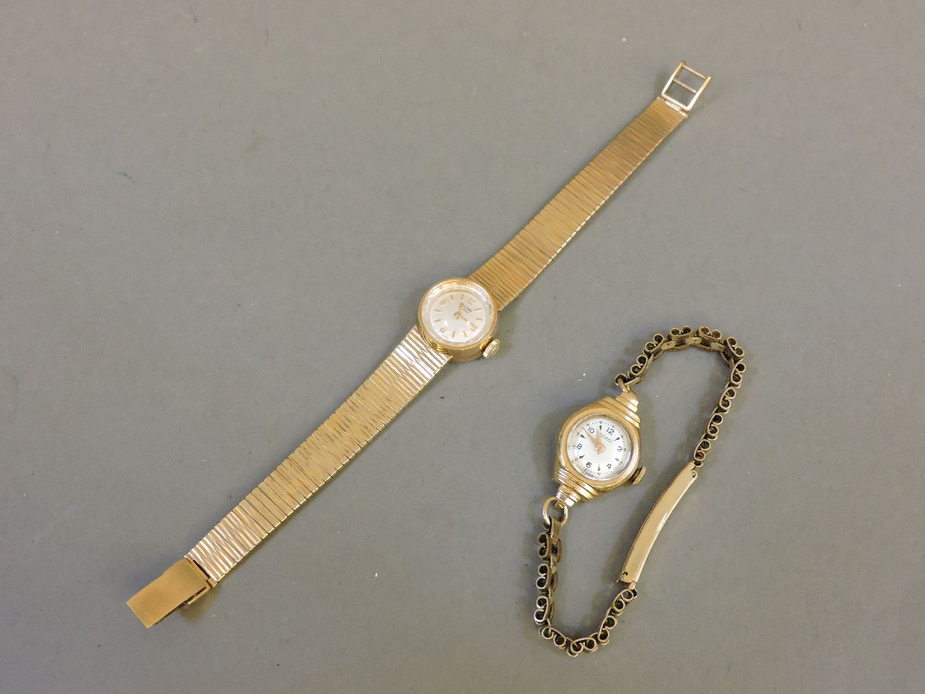 A ladies 9ct gold Record bracelet watch, and a ladies 9ct gold Rotary