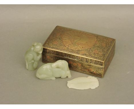 A brass box, with three green jade items, horse, two fish, and a monkey
