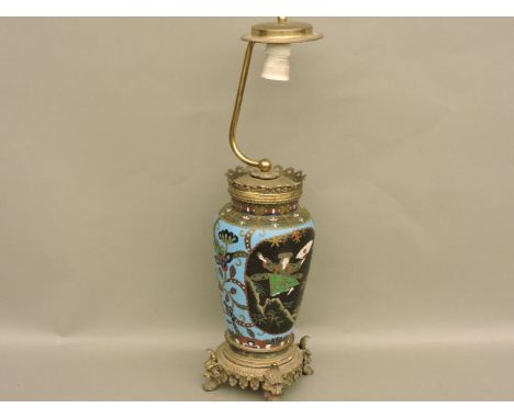 A 19th century cloisonné table lamp, standing on a pierced base