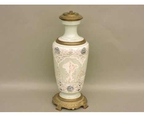 An Arts and Crafts period table lamp, of celadon colour with Islamic text as decoration