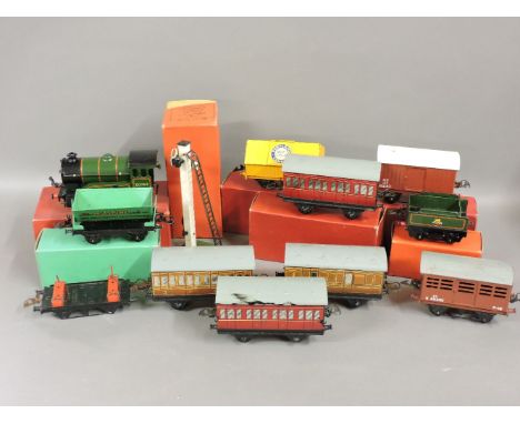 A collection of Hornby 'O' gauge, a no 51 loco and tender, both boxed, three passenger coaches, no 1 and no 41, a passenger b