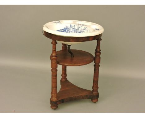 A Victorian ceramic wash basin, with printed bird design, upon a turned wood stand, 85cm high
