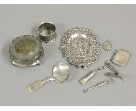 A small group of silver items, including a Continental pin tray, a dressing table box, and a white metal caddy spoon, approxi