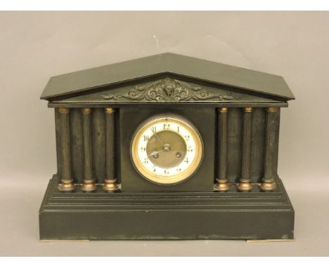 A Victorian black slate mantel clock