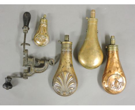 Four 19th century copper and brass powder flasks, one stamped 'G and J W Hawksley' including a pistol flask, and a cartridge 
