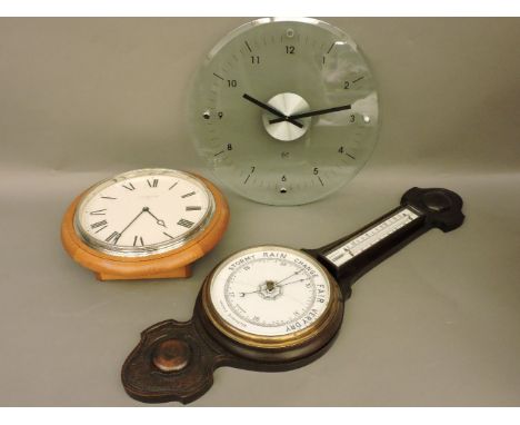 A modern glass wall clock, signed DD, a wooden wall hanging clock, and an oak antique style banjo barometer