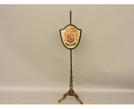 A tapestry fire screen, on stand