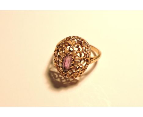A 9ct gold amethyst and cultured pearl cluster ring, with pierced scrolling head, two pearls deficient